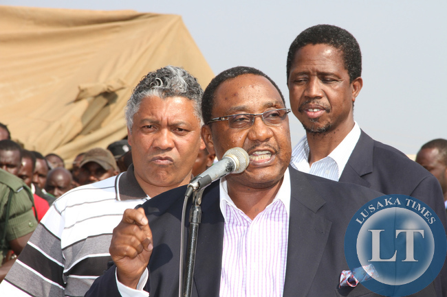 PF Secretary General Edgar Lungu with Kasama central member of Parliament Geoffrey Bwalya Mwamba and Kabwata member of parliament Given Lubinda during a rally to drum up support for Solwezi PF parliamentary candidate Newton Malwa on September 10 ,2014 -Picture by THOMAS NSAMA