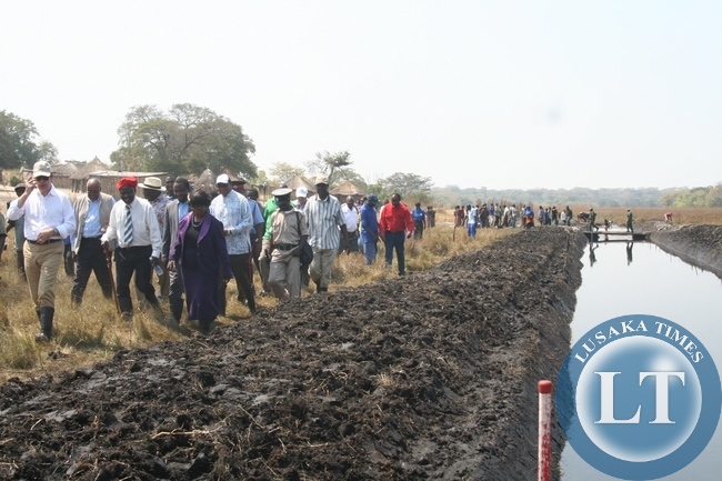 The visiting World Bank Group touring the 20 kilometre Natonga Canal during the visit of the Zambia Strengthening Climate Resilience Project in the Barotse Sub-Basin in Imalyo area of Mongu District, Western Province