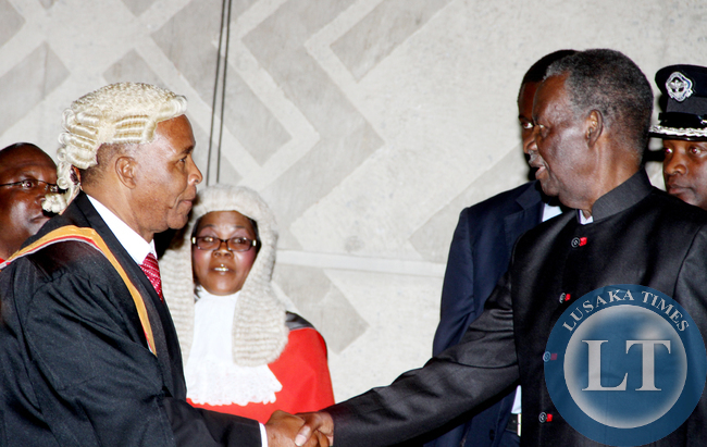 President Sata greets deputy speaker of the Natiional Assembly Mkhondo Lungu during the opening of parliament on September 19, 2014 -Picture by THOMAS NSAMA