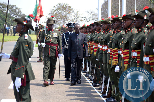 President Michael Sata inspects a guard of honour at Parliament grounds in Lusaka