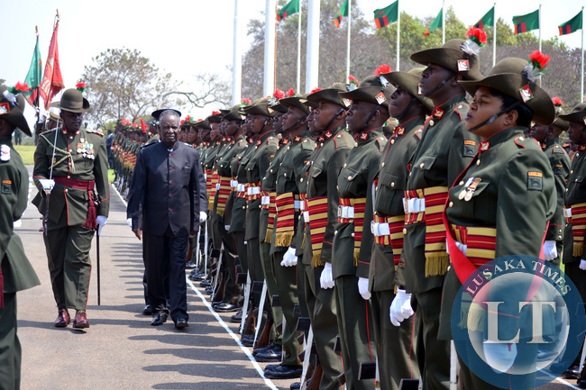 President Michael Sata inspects a guard of honour at Parliament grounds in Lusaka