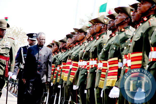 President Sata inspects a guard of honour during the opening of parliament on September 19, 2014 -Picture by THOMAS NSAMA