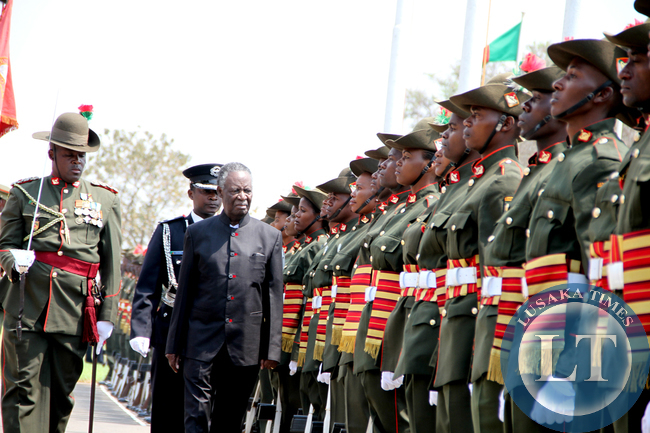 President Sata inspects a guard of honour during the opening of parliament on September 19, 2014 -Picture by THOMAS NSAMA