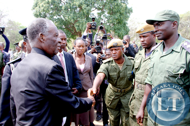 President Sata greets police officers on arrival at the National Assembly of Zambia for the opening of parliament on September 19, 2014 -Picture by THOMAS NSAMA