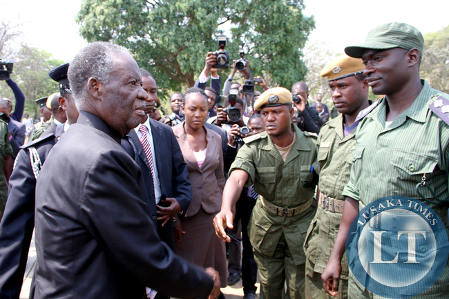 President Sata greets police officers on arrival at the National Assembly of Zambia for the opening of parliament on September 19, 2014 -Picture by THOMAS NSAMA