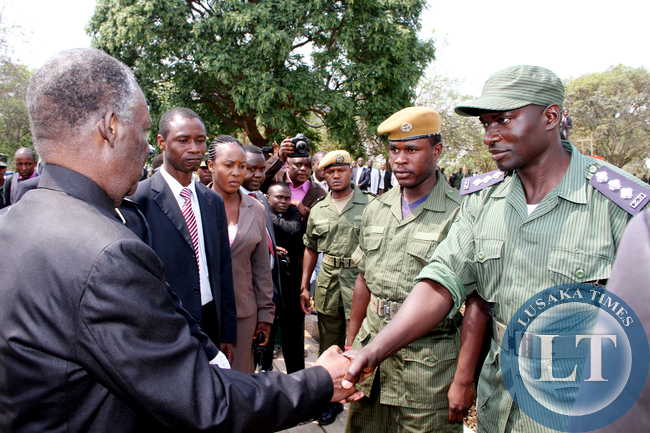 President Sata greets police officers on arrival at the National Assembly of Zambia for the opening of parliament on September 19, 2014 -Picture by THOMAS NSAMA