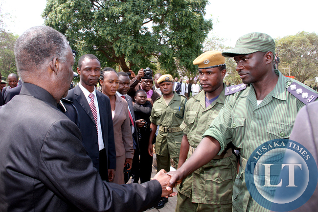 President Sata greets police officers on arrival at the National Assembly of Zambia for the opening of parliament on September 19, 2014 -Picture by THOMAS NSAMA