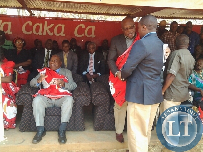 FORMER republican president Rupiah Banda while MMD leader Nevers Mumba talking Commerce Deputy Minister Miles Sampa during the Kulamba ceremony of the Chewa people in Katete