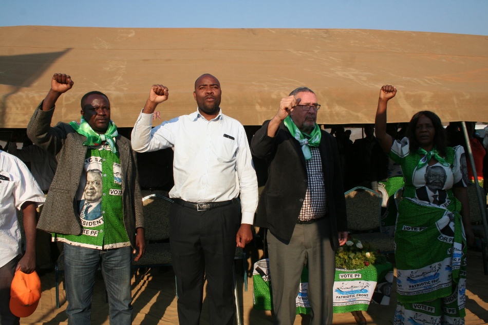 From left to right: EASTERN Province PF Chairperson, Artan Mwamba, Eastern Province Minister, Malozo Sichone, Vice President, Dr. Guy Scot and Vubwi constituency by-election candidate, Margaret Miti, sing the national anthem before a rally addressed by Dr. Scott at Vubwi Boma in Vubwi