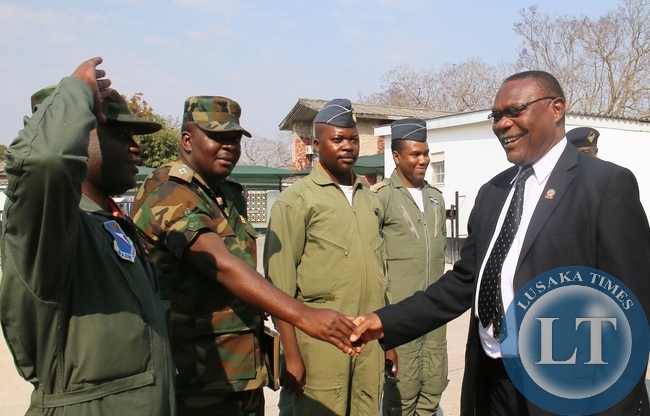 LUAPULA Province Minister Brigadier General Benson Kapaya greeting a Team from Zambia Air Force (ZAF) who paid a courtesy call at his office recently. ZAF was in Luapula for a routine flying program.