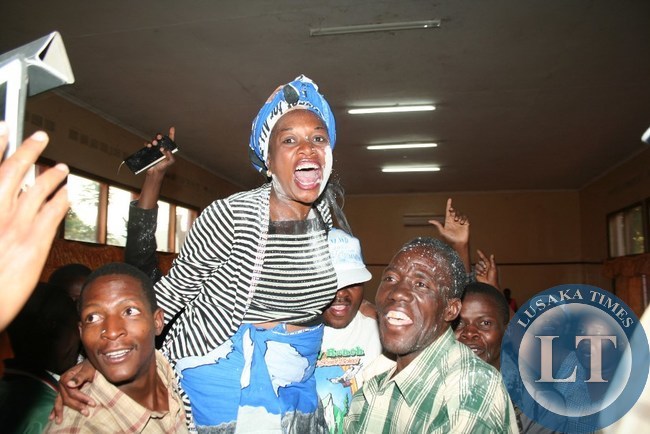 MMD members lift high Victoria Kalima as they celebrate her victory of the Kasenengwa by-election at Chipata Municipal Council in Chipata