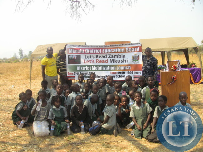 Pupils at chibefwe school pausing during the launch of the ‘LET’S READ ZAMBIA, LETS READ MKUSHI’ Campaign in the District during the launch of the ‘LET’S READ ZAMBIA, LETS READ MKUSHI’ Campaign in the District