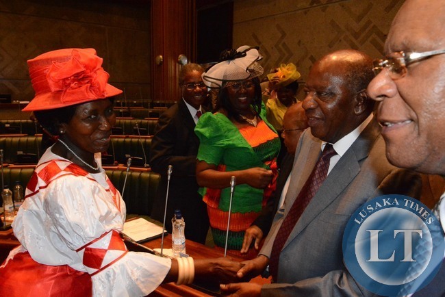 Gender Minister Inonge Wina congratulates Finance Minister Alexander Chikwanda shortly after Finance Minister delivered the 2015 budget