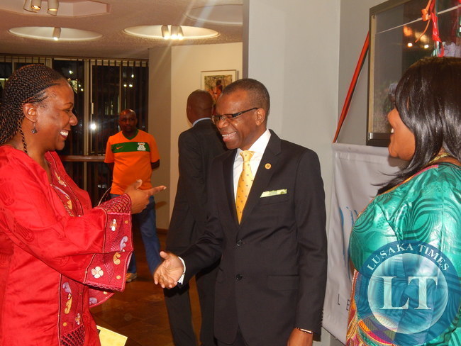 Zambia's High Commissioner to South Africa, His Excellency Mr. Muyeba Chikonde, with his wife in green, welcomes South Africa's Energy Deputy Minister, Ambassador Thembisile Majola.