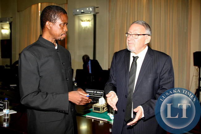 Acting President Guy Scott listens to Defence and Justice minister Edgar Lungu shortly after Cabinet meeting at State House on October 29,2014 -Picture by THOMAS NSAMA