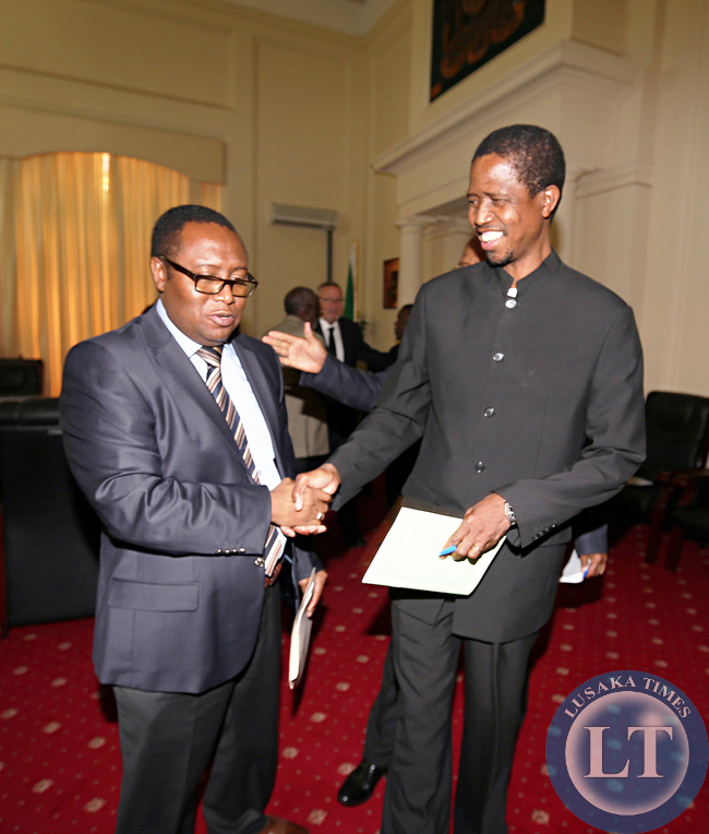 Attorney General Musa Mwenye thanks Mr Edgar Lungu after a Special Session Of Cabinet meeting at Statehouse. Vice President Dr Guy Scott is now the Acting President of the Zambia. Picture by Eddie Mwanaleza/Statehouse 29th October 2014.