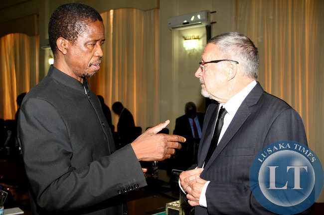 Acting President Dr Guy Scott (r) listens to Defence and Justice minister Edgar Lungu shortly after Cabinet meeting at State House on October 29,2014 -Picture by THOMAS NSAMA