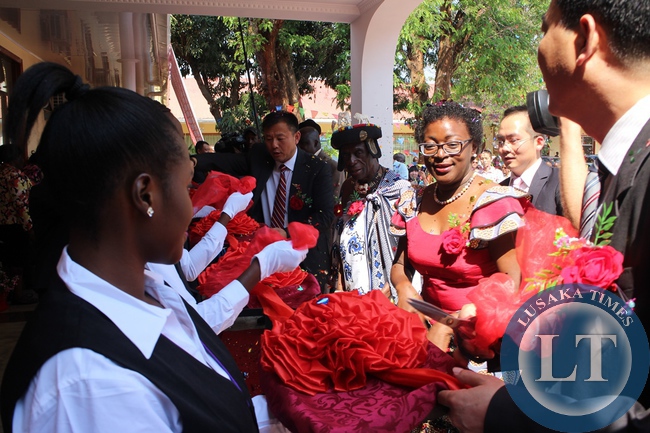 Zambia’s First Republican President Kenneth Kaunda’s daughter, Cheswa Kaunda Silwizya (far right in red dress), Senior Chief Mukuni (next to her) and Oriental Swan Hotel managing director Xuan Yabiao (far left) during the official opening of the Hotel in Livingstone