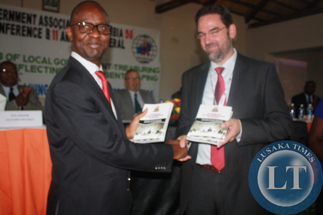 LGAZ president Mulenga Sata (left) and German Embassy Counsellor Frank Hofmann (right) at Chrismar Hotel in Livingstone during the launch of a book titled 50 years of local government in Zambia.