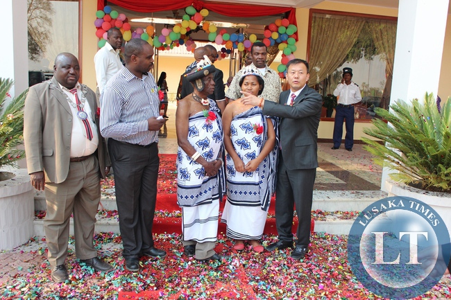 Oriental Swan Hotel managing director Xuan Yabiao (far right), Senior Chief Mukuni of Kazungula District in Southern Province (middle), his wife Victoria (second from far right), Livingstone District Commissioner Omar Munsanje (second from far left) and Livingstone Mayor Milford Maambo (far left) during the official opening of the Hotel in Livingstone