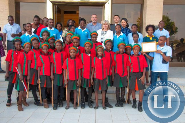 Vice President Hon. Dr Guy Scott and Dr Charlotte Scott with Huawei Technologies Zambia representative Jacky Zhang and 'Families are Nations' award-winners and performers.