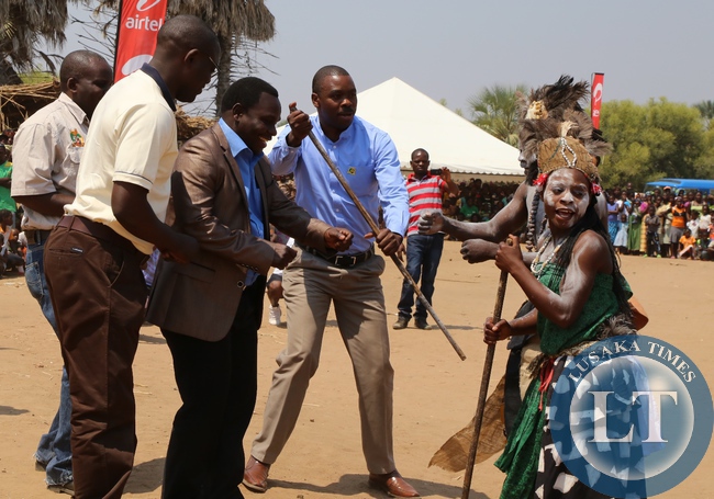 ,Lusaka Province Minister Philip Kosamu flanked by his Deputy PS Bright Nundwe joins the madalas cultural group during the Zambangulwe Traditional Ceremony of His Royal Highness Chief Chipepo of Chirundu District