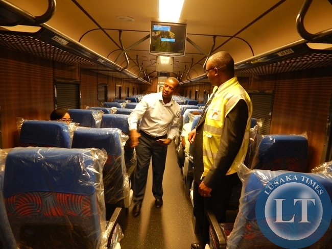 Transnet Engineering General Manager for Coaches Business, Mr. Peter Cona explains a point to First Secretary for Economic and Trade at the Zambia High Commission, Mr. Mande Kauseni (l) in one of the Business Class coaches