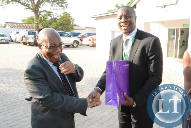 ZAMTEL CEO Mupanga Mwanakatwe showing (2nl) showing round the training centre to Communication Minister Yafya Mukanga and his counterpart Education Minister John Phiri (l) whilst flanked by ZAMTEL Chief Human Resource and Administration Officer Mooka Silumbu (2nl) during the tour the ZAMTEL training centre
