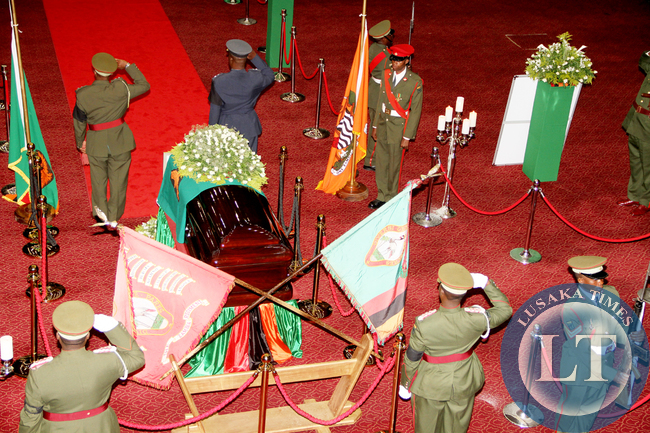 Defence personnel salutes during the Body viewing ceremony of President Sata at Mulungushi International Conference Centre -Picture by THOMAS NSAMA