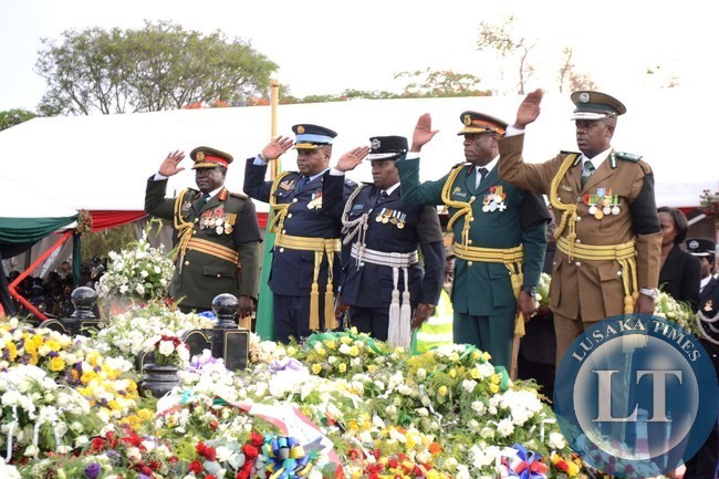DEFENSE Chiefs salute after laying wreaths at the grave of the late President Michael Sata during the burial