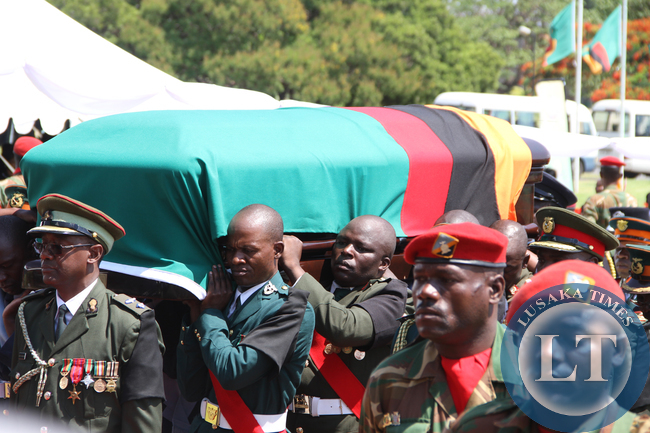 Defence force personnel carrying a casket on arrival at Parliament for the Interdenominational Thanks giving requiem church service of President Sata on November 10,2014 -Picture by THOMAS NSAMA