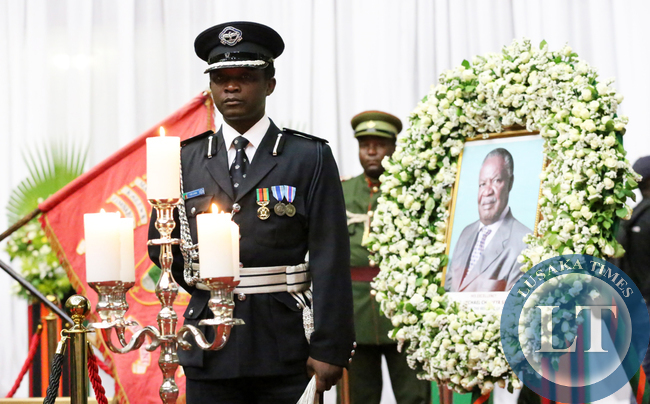 Police officer Yobe Luhana ADC to the late President Sata Salutes at Mulungushi Hall during the Body Viewing Ceremony of the late President Sata .Picture by Eddie Mwanaleza