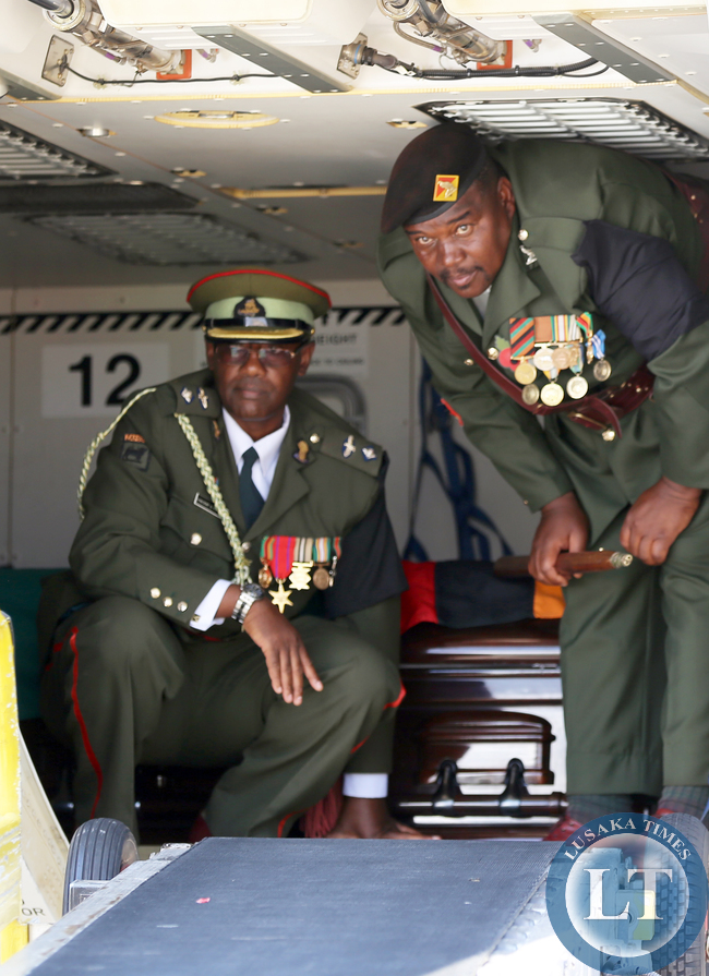 Zambia army Officers about to offload the casket from the Plane at KK international airport 2946