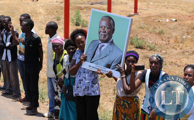 Lusaka residents waiting to catch a glimpse of the funeral procession