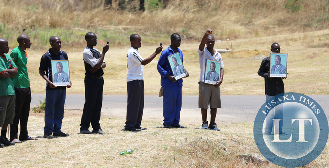 Lusaka residents waiting to catch a glimpse of the funeral procession
