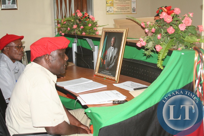 Barotse Royal Establishment (BRE) Induna Kalonga (r) and Induna Katema signing in the book of condolences for the Late President Michael Chilufya Sata at Provincial Administration in Mongu District, Western Province, November 4, 2014.