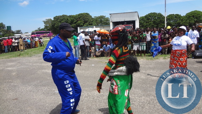 A jubilant MMD Die Hard National Youth Coordinator Bowman Lusambo dancing at Mongu airport