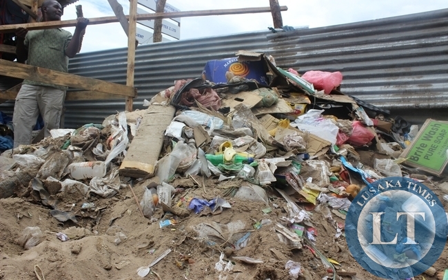 A HEAP of uncollected garbage behind a shopping mall in Choma