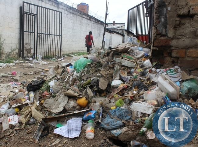 A HEAP of uncollected garbage behind a shopping mall in Choma