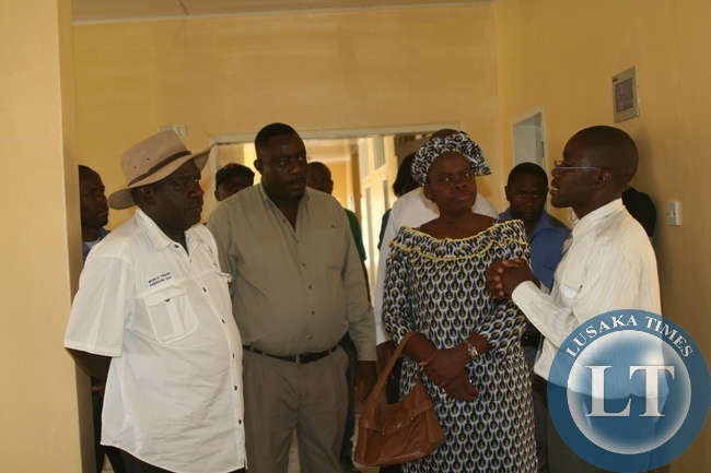 Lewanika General Hospital Medical Superintendent Dr. Kambinda Likambi (r) explains to Cabinet Office Permanent Secretary for Special Duties Bert Mushala (l) the construction progress of maternity wing which is near completion soon as Mongu District acting Commissioner Alice Mutemwa (c) and Lewanika General Hospital Senior Environmental Officer ChilwanaJunist (2nd l) listen during the tour in Western Province to compile major developmental projects,