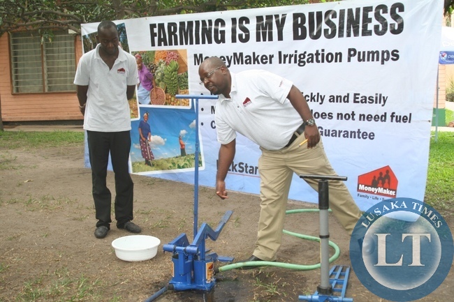 KickStart International Zambia Western Province Regional Manager kapalu Muswala (r) explaining the advantages of both the MoneyMaker Irrigation Treadle Pump (l) and Hip Irrigation Pump (r) to peasant farmers as his field officer Victor Nanga (l) looks on during the launch of KickStart International Zambia Programme in Mongu District, Western Province, KickStart International Zambia Western Province Regional Manager kapalu Muswala (r) explaining the advantages of both the MoneyMaker Irrigation Treadle Pump (l) and Hip Irrigation Pump (r) to peasant farmers as his field officer Victor Nanga (l) looks on during the launch of KickStart International Zambia Programme in Mongu District, Western Province,