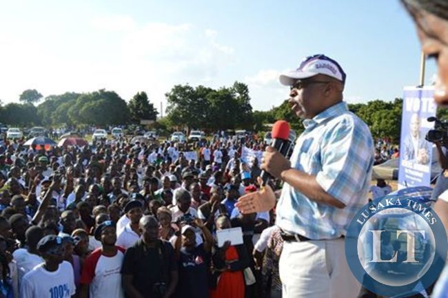 Nevers Mumba speaking at the rally