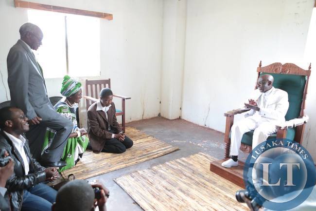 Edgar Lungu kneeling before Henry Sosala