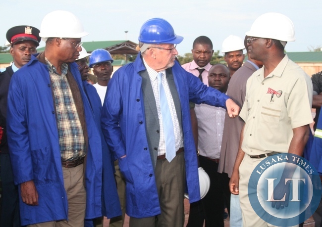 Acting President Guy Scott being shown newly constructed government fuel tankers by Tazama pipeline managing director Davison Thawethe (r ) during the tour of the facility as Local government minister Emmanuel Chenda (l ) looks on.
