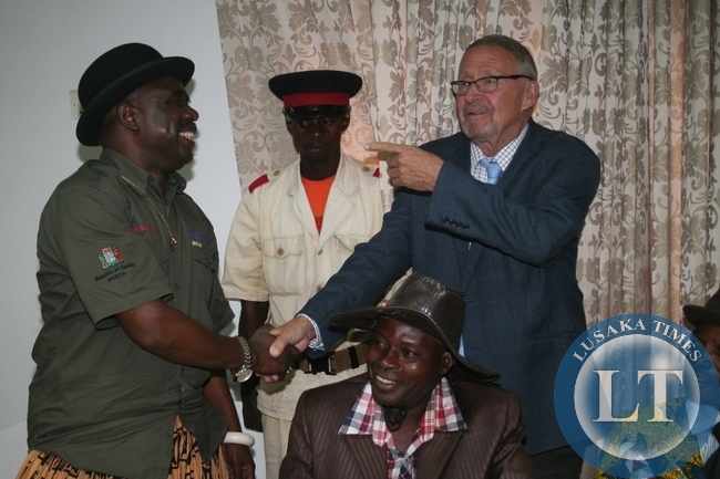 Acting President Guy Scott being greeted by chief Mumena (l) during the meeting with Solwezi based traditional leaders at Solwezi Lodge on Thursday in Solwezi