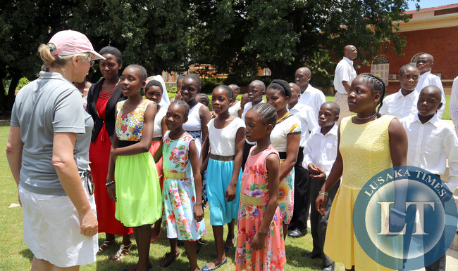 Dr Charotte Scott with Children From Kasisi Home at State house Golf Tournment on Sunday -Picture y Eddie Mwanaleza.