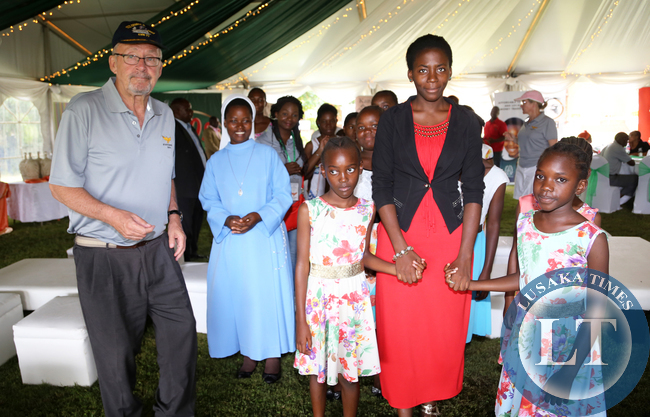Dr Guy Scott with Children From Kasisi Home at State house Golf Tournment on Sunday -Picture y Eddie Mwanaleza.