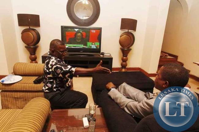 Edgar Lungu being congratulated by one of his campaign staff after being declared winner