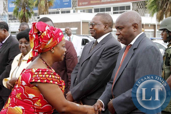First Lady Esther Lungu greets senior Government officials on arrival at Kenneth Kaunda International Airport shortly before departure to Addis Ababa, Ethiopia where she accompanied the President for the African Union Summit on January 29,2015 -Picture by THOMAS NSAMA