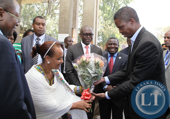 President Edgar Lungu receives a bouquet of flowers from Hilton Guest Relations Manager on arrival at Hilton Hotel in Addis Ababa, Ethiopia.